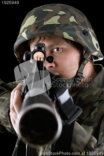 Image of Man pointing a rifle