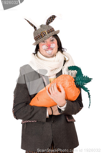 Image of Portrait of young man with carrot