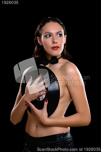 Image of Nice young woman topless with vinyl