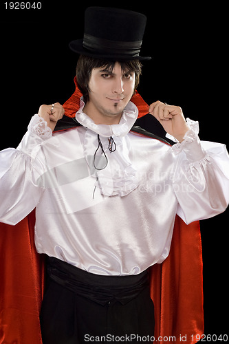 Image of young man in a suit of Count Dracula