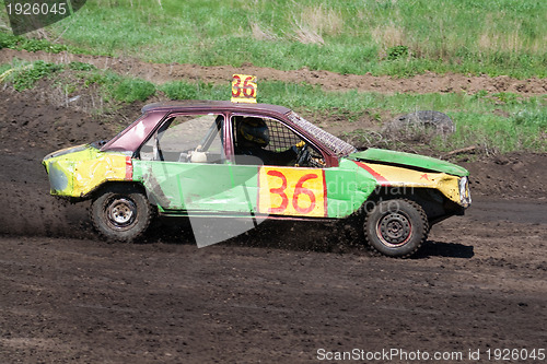Image of Race for survival. Green yellow car