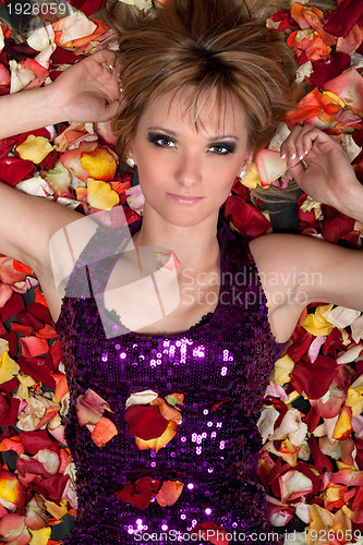Image of sensual young blonde lying in rose petals
