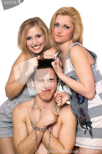 Image of Two playful blonde and a guy in chains