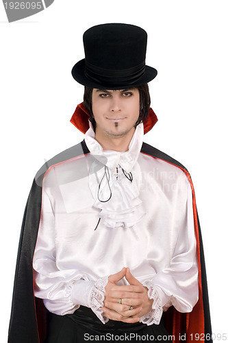 Image of young man in a suit of Count Dracula