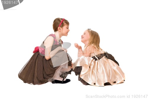 Image of Two beautiful little girls talking