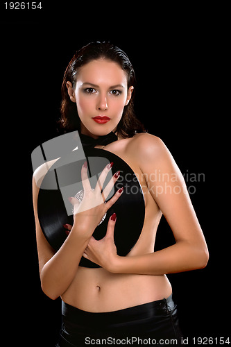 Image of Sexy young brunette topless with vinyl