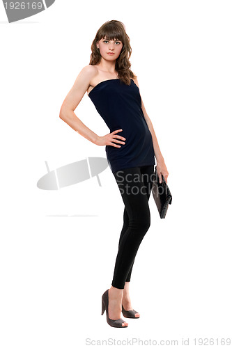 Image of Pretty girl in black leggings with a handbag