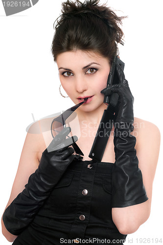 Image of Portrait of pretty young woman talking on the phone