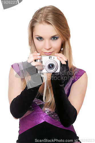 Image of Young attractive blonde holding a photo camera. Isolated