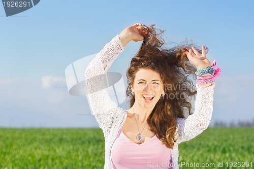 Image of Portrait of joyful lovely young woman