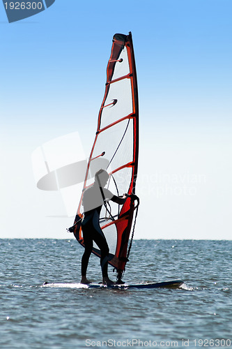 Image of Silhouette of a man windsurfer