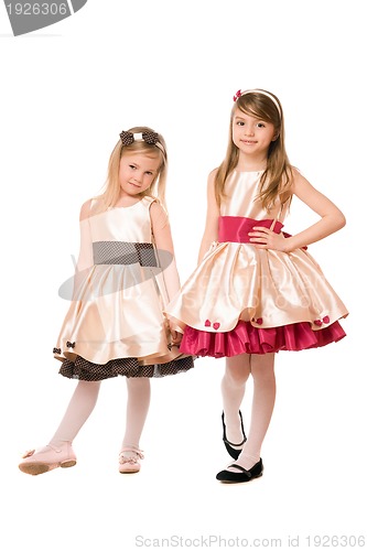 Image of Two cute little girls in a dress
