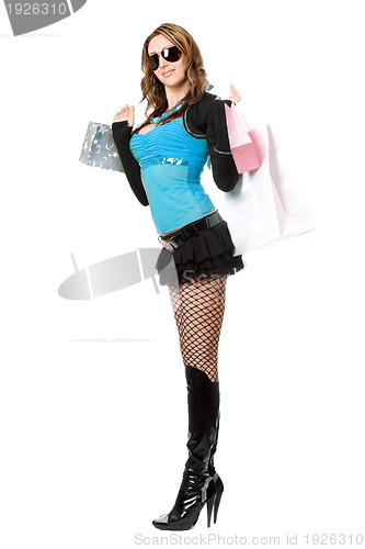 Image of Beautiful playful young woman after shopping. Isolated