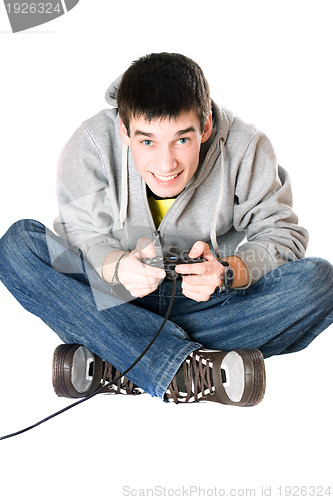 Image of Young man with a joystick for game console