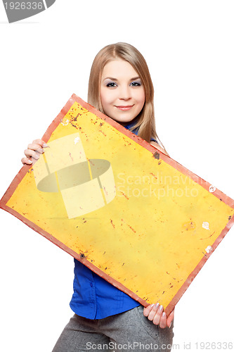 Image of Smiling young woman posing with yellow vintage board