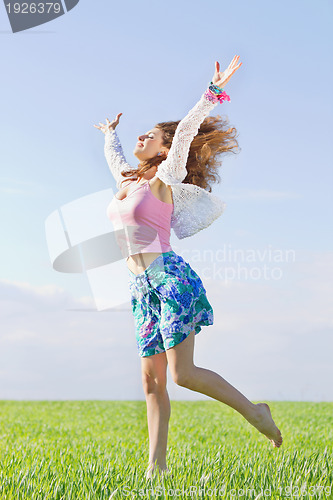 Image of Happy beautiful young woman