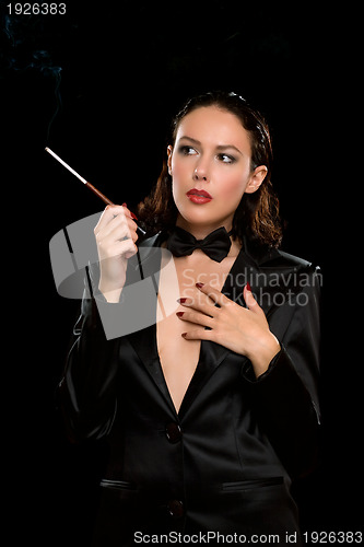 Image of Portrait of a elegant young woman with cigarette