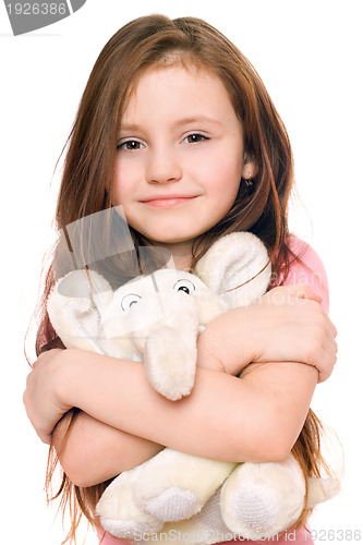 Image of Portrait of smiling little girl with a teddy elephant