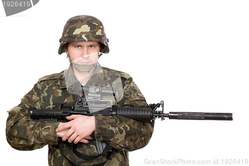 Image of Soldier hugging m16