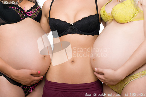 Image of Three female tummy. Isolated