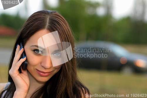 Image of young woman calling by phone