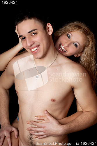 Image of Portrait of joyful young couple. Isolated on black