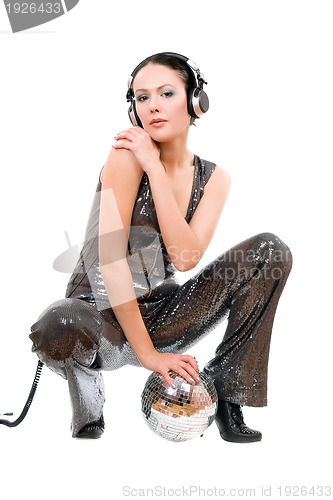 Image of Young brunette in headphones