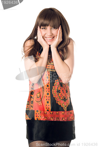 Image of young woman touching her face