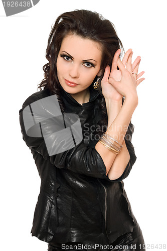 Image of Portrait of pretty young brunette in black clothes