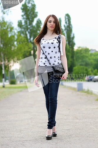 Image of Sexy young woman walking