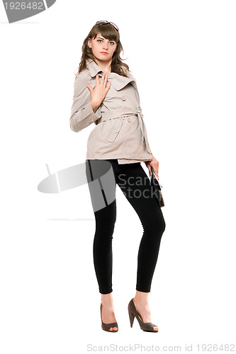 Image of Pretty girl wearing a coat and black leggings