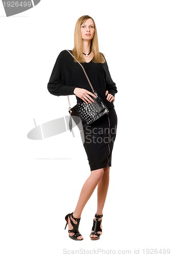 Image of Blonde in black. Full length