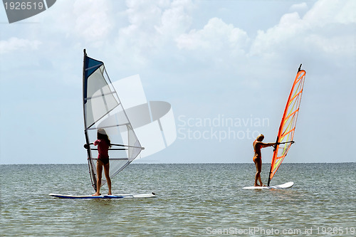 Image of Two girls windsurfers