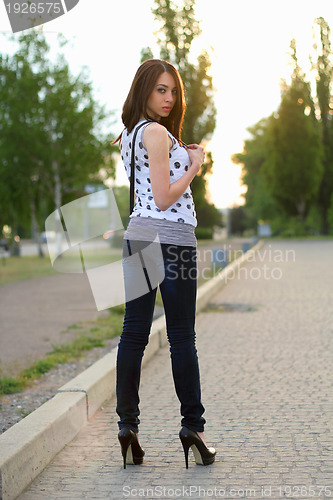 Image of woman standing on the sidewalk