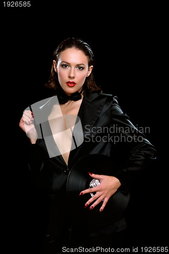 Image of Seductive brunette wearing a black suit