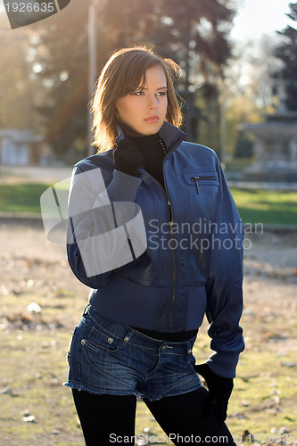 Image of attractive girl in autumn park