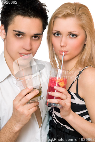 Image of Happy young couple with cocktails. Isolated