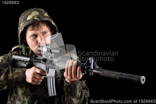 Image of Aiming soldier with a rifle 