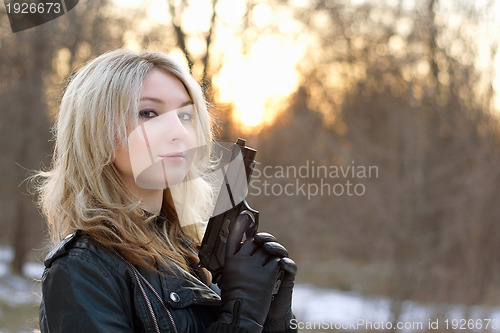 Image of Provocative young woman at sunset