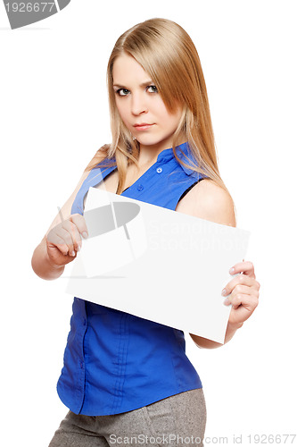 Image of Serious young woman holding empty white board