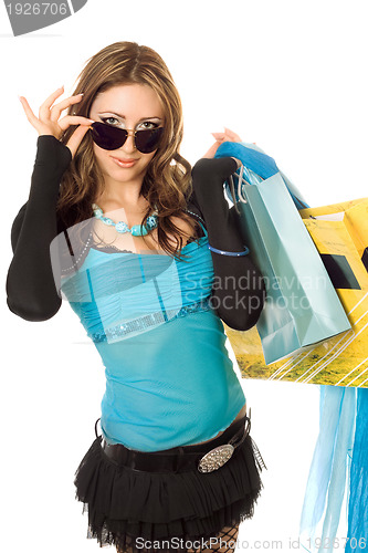 Image of Playful young woman after shopping. Isolated on white