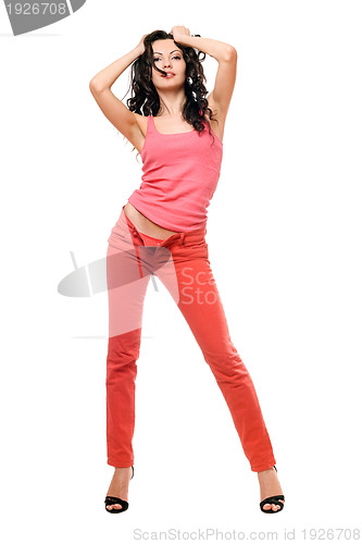 Image of Sexy playful young brunette in a red jeans