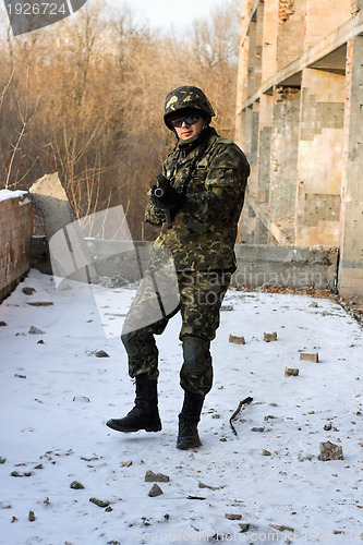 Image of Strong military man with weapon