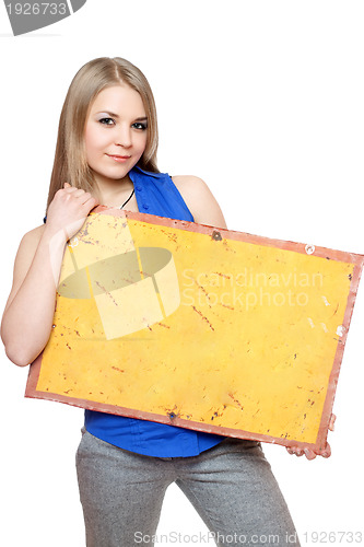 Image of Lovely young woman posing with yellow vintage board