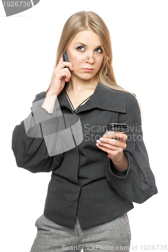 Image of Portrait of thoughtful young blonde in a gray business suit