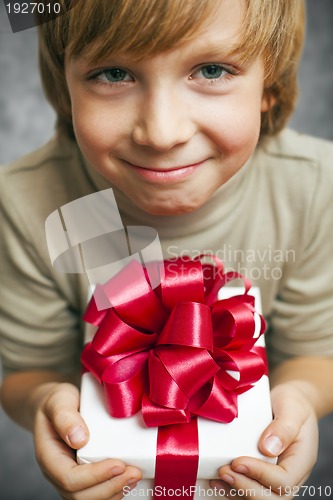 Image of Boy holding present box