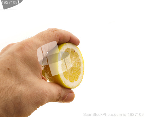 Image of fresh half lemon on hand