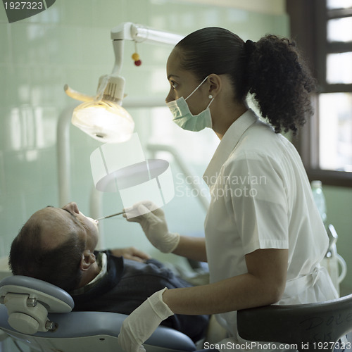Image of Female dentist during a stomatological procedure