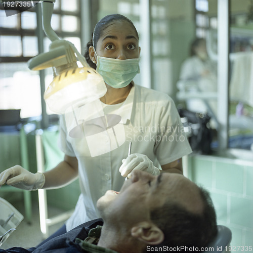 Image of Latina dental nurse and patient