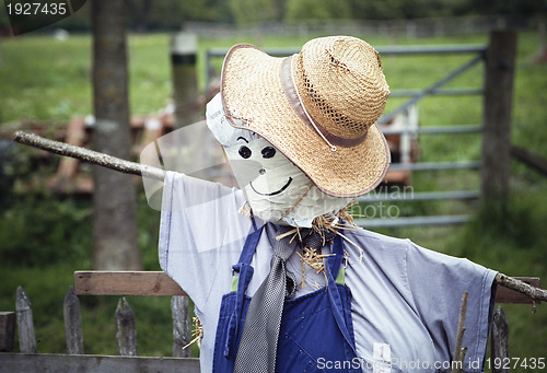 Image of Stylish scarecrow with tie and hat